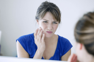 Lady needing to see an emergency dentist in Southport