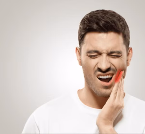 A man struggling with pain needing an emergency dentist in Liverpool
