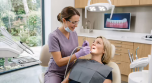 Dental hygienist carrying out a dental hygiene appointment for a patient at Azure Dental in Formby