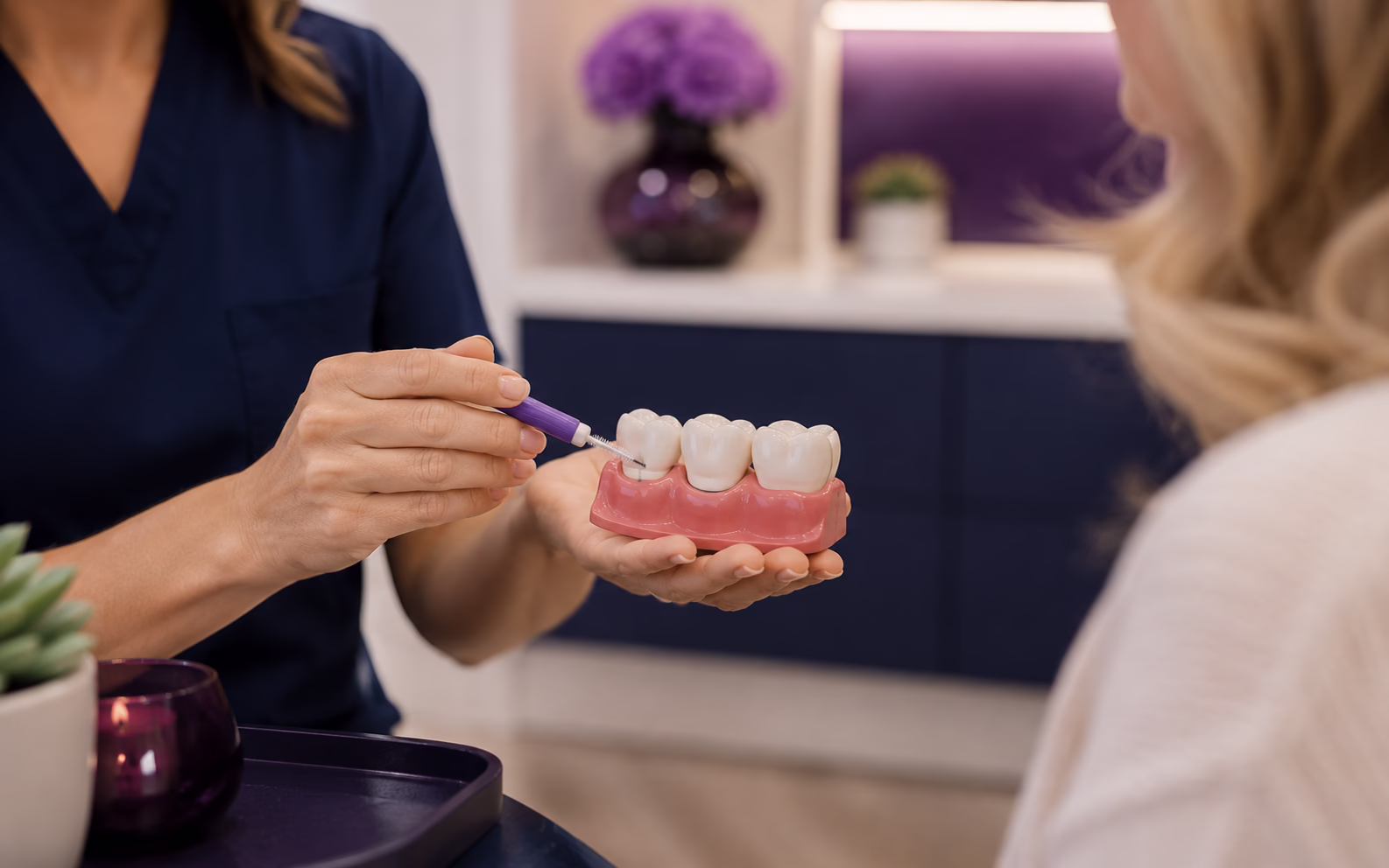 Cleaning around the gumline of a dental crown at Azure Dental